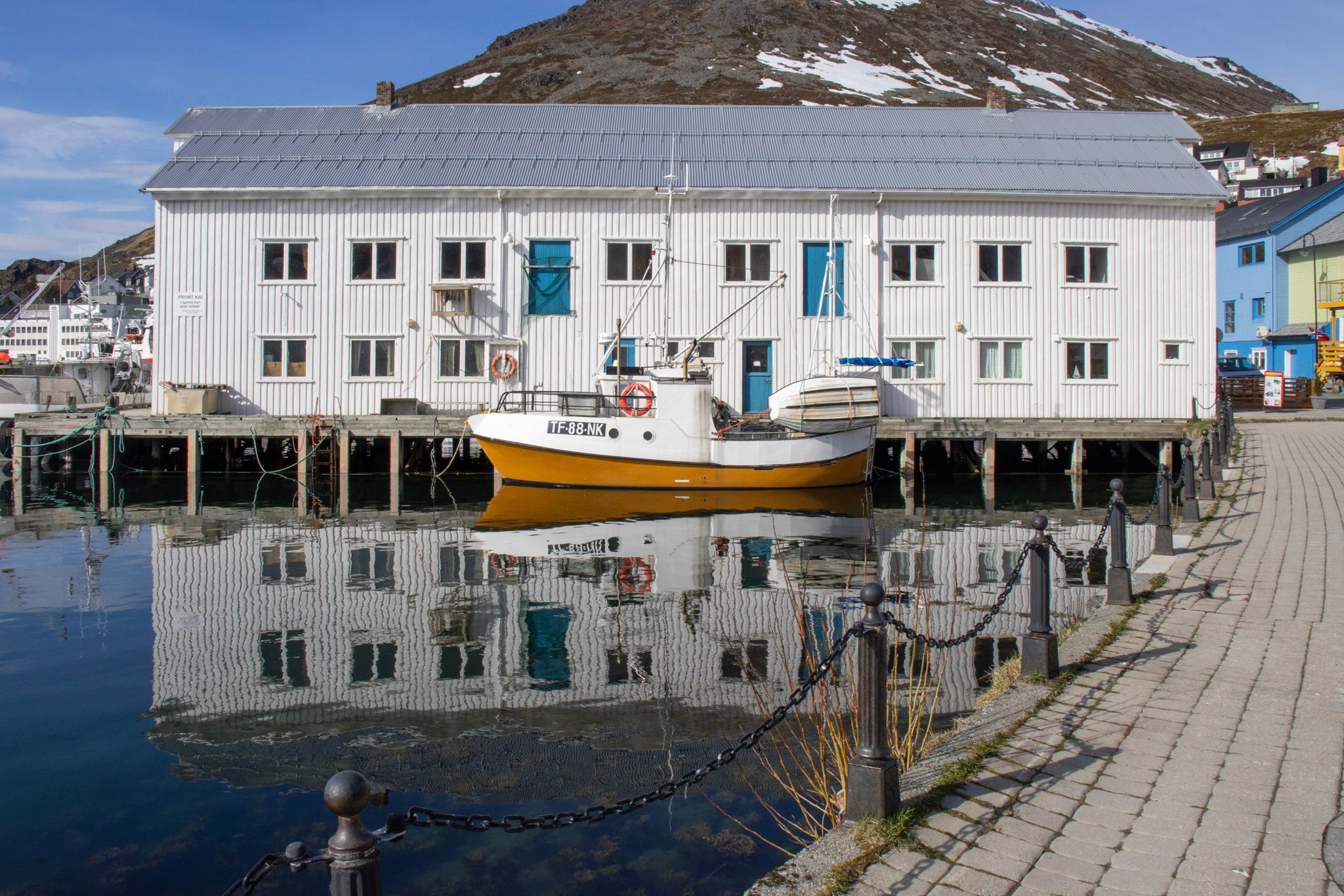 Fishing Boat Reflection in Honningsvåg Harbor, Norway – Original Arctic Travel Photography Wall Art